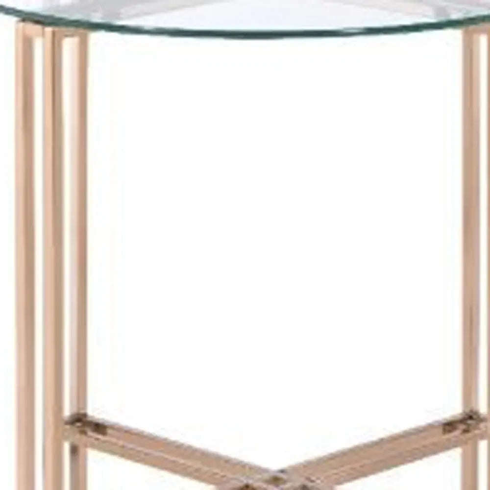 Modern round glass side table with sleek rose gold metal legs, perfect for contemporary home decor.
