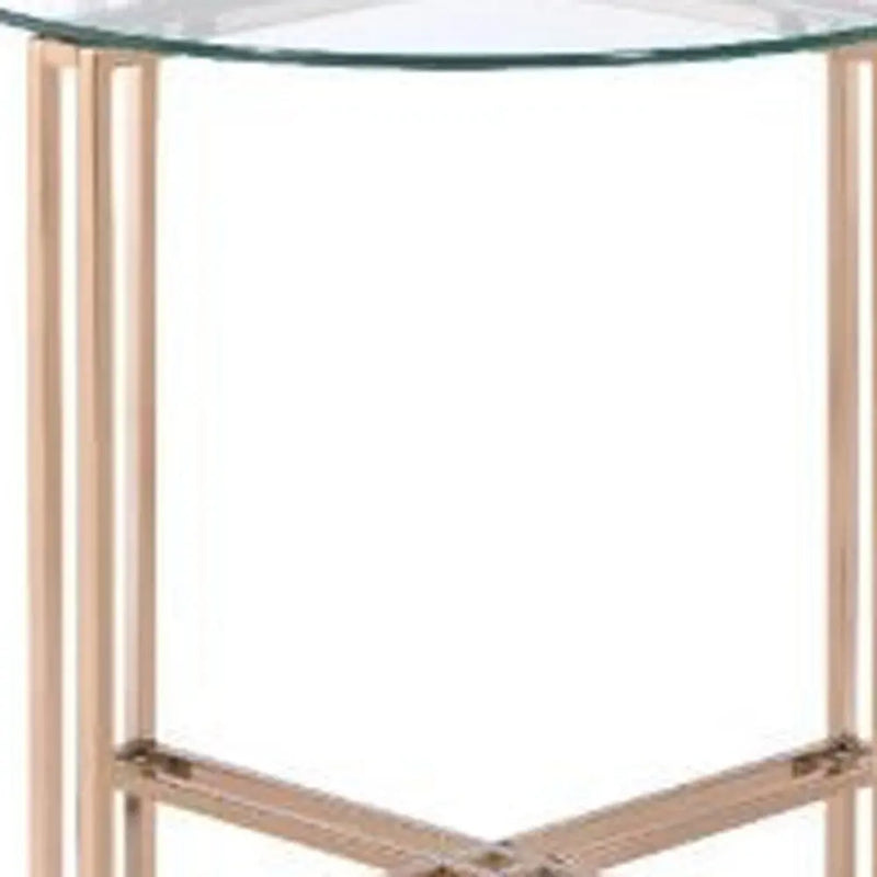 Modern round glass side table with sleek rose gold metal legs, perfect for contemporary home decor.