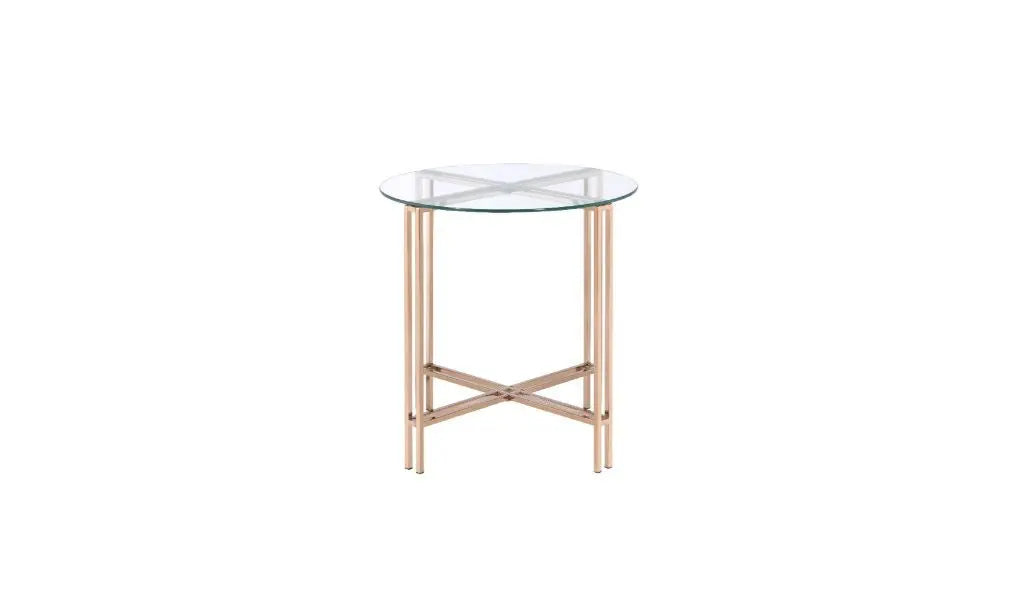 Round glass side table with rose gold metal legs in a modern, minimalist design.