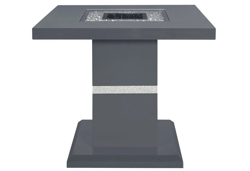 Modern dark gray square fire pit table with a glass insert and sleek pedestal base, perfect for outdoor gatherings.