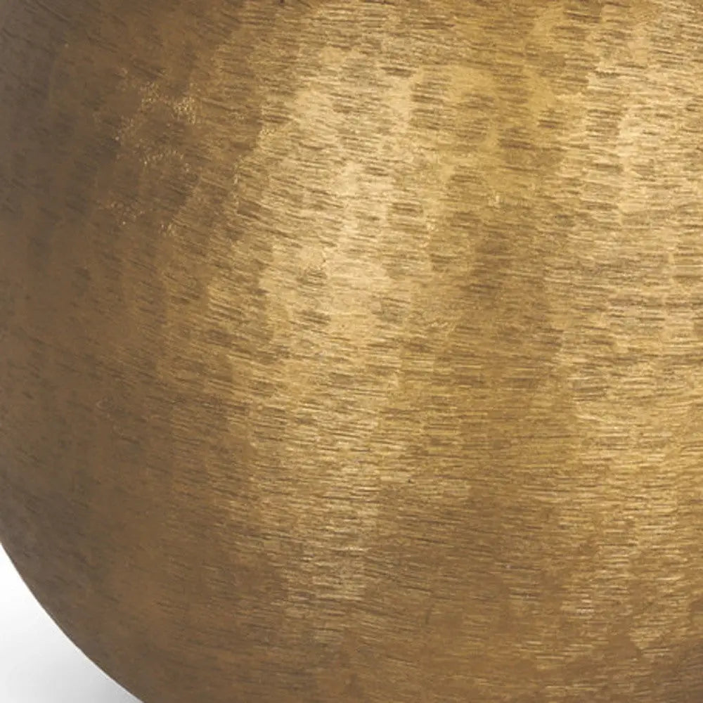 Brushed gold metal vase with a modern, textured finish, perfect for contemporary home decor.