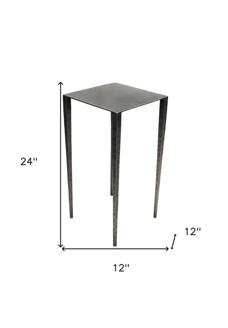 Black metal side table, 24" tall, 12" square top, sleek modern design with tapered legs.