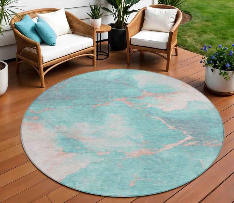 8' Teal Blue Peach And Ivory Round Abstract Washable Indoor Outdoor Area Rug