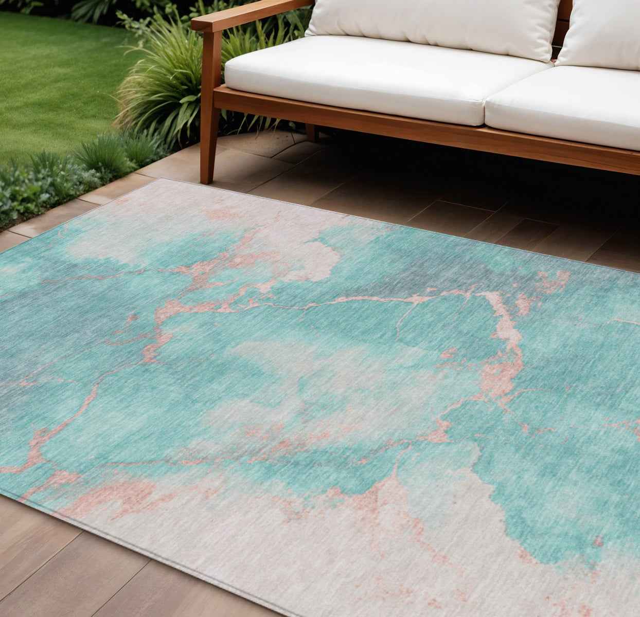 8' X 10' Teal Blue Peach And Ivory Abstract Washable Indoor Outdoor Area Rug