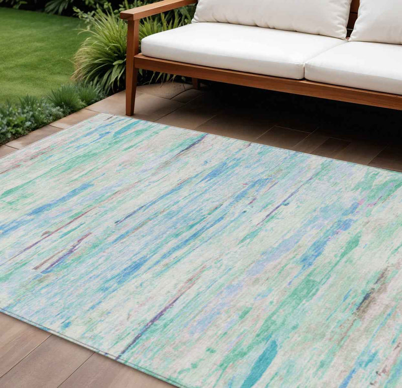 10' X 14' Teal Blue And Ivory Abstract Washable Indoor Outdoor Area Rug