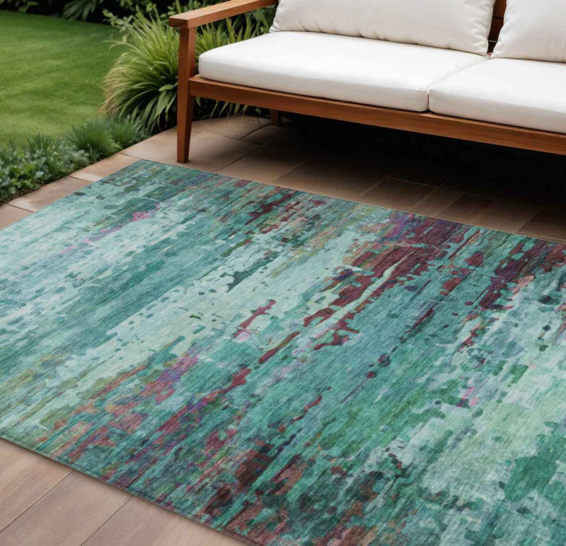 8' X 10' Teal Blue Pale Aqua And Plum Abstract Washable Indoor Outdoor Area Rug