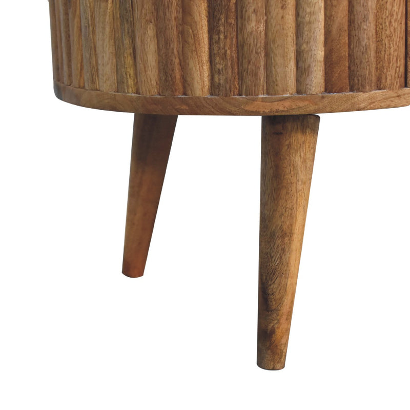 Solid wood coffee table leg and apron detail under the oval tabletop