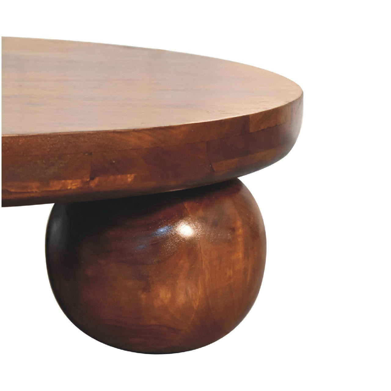 Chestnut round solid-wood coffee table with rounded bulb base and smooth top.
