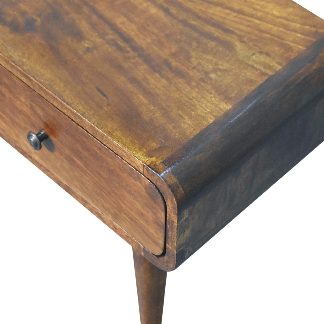 Chestnut wood coffee table corner with rounded trim and drawer pull