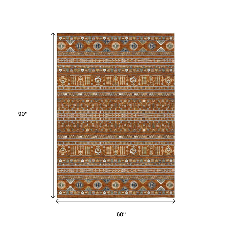 5' X 8' Rust Blue And Ivory Tribal Washable Indoor Outdoor Area Rug