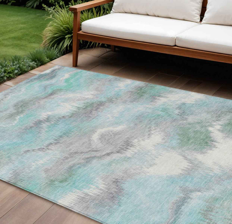 10' X 14' Teal Blue And Ivory Abstract Washable Indoor Outdoor Area Rug