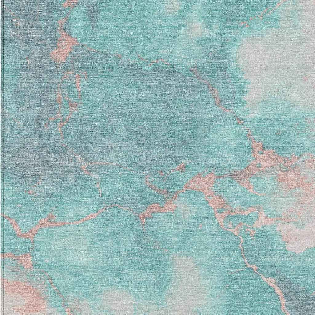 10' X 14' Teal Blue Peach And Ivory Abstract Washable Indoor Outdoor Area Rug