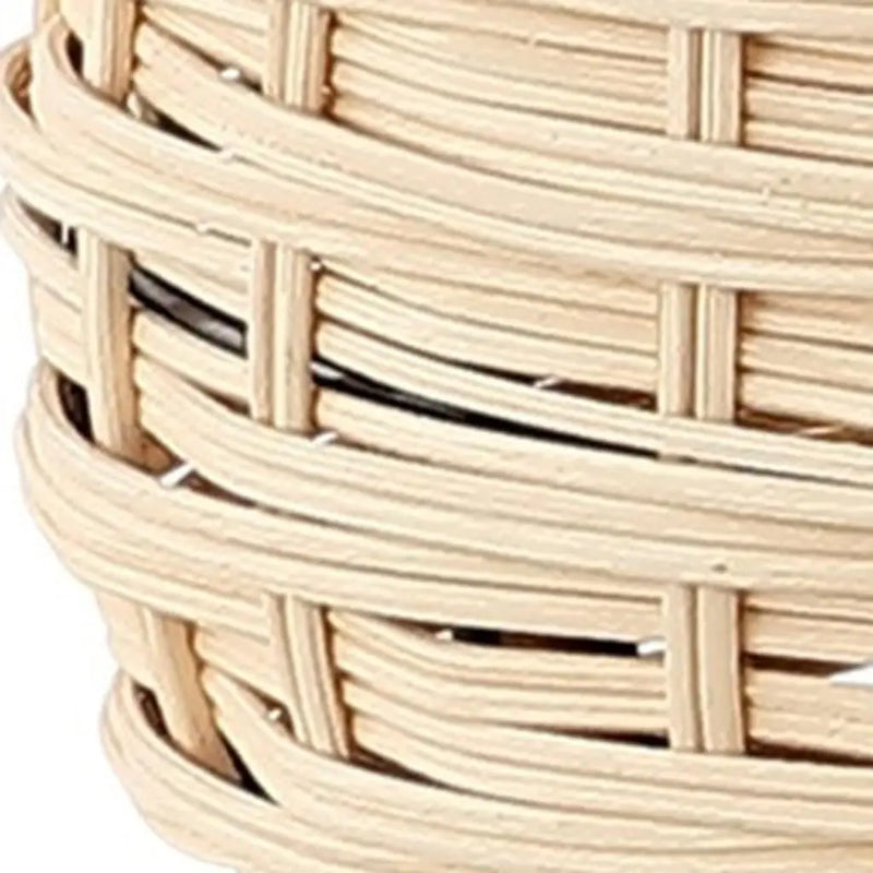 Handwoven natural wicker basket in light beige, perfect for storage and home decor. Stylish and functional accessory.