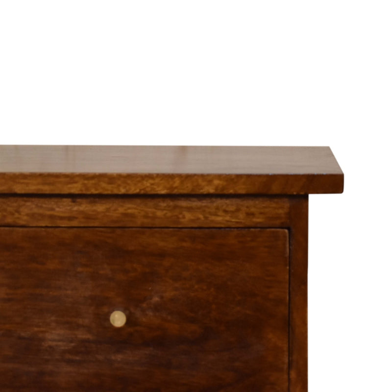 Chestnut nightstand drawer front detail with round metal knob and wood grain