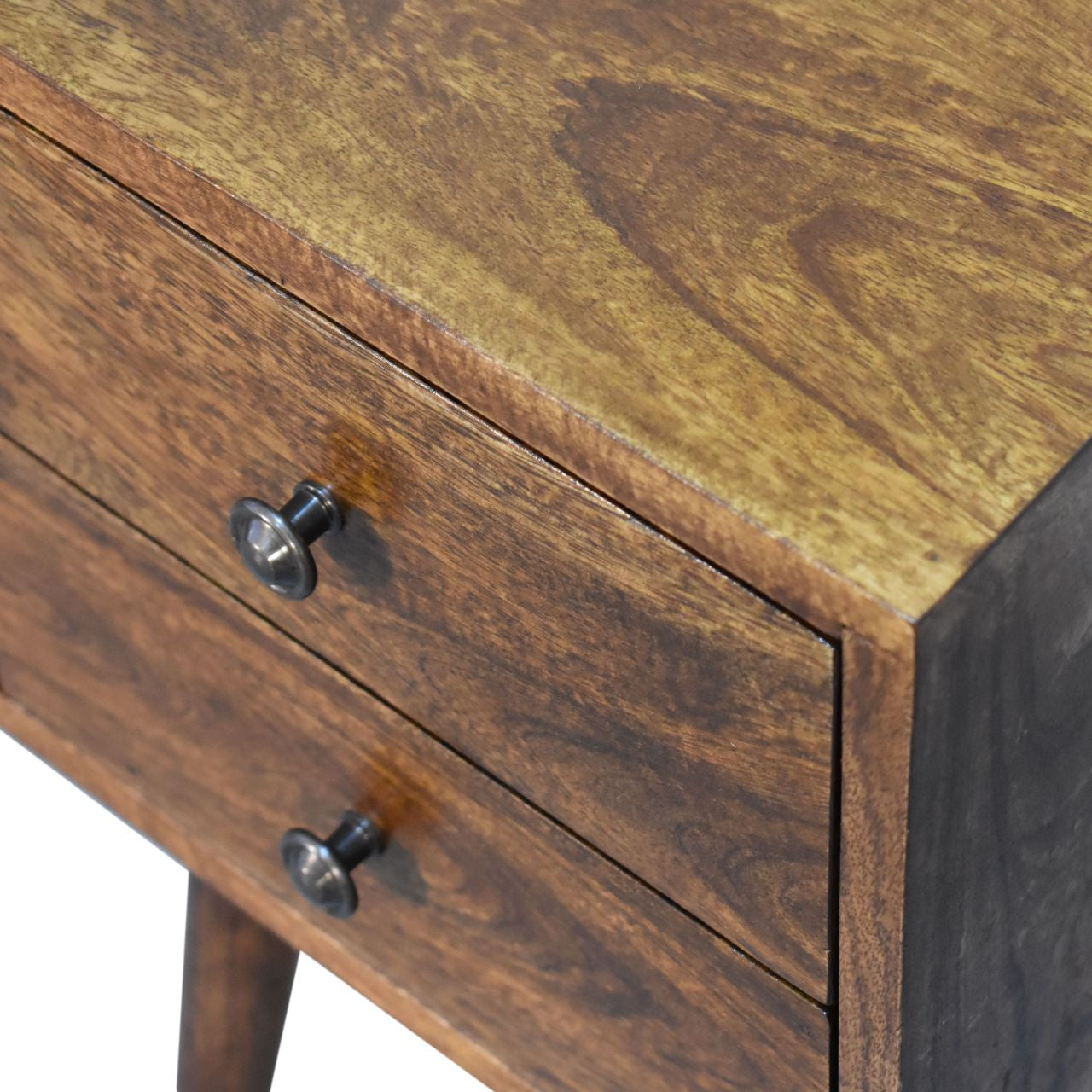 Chestnut drawer fronts with two round metal knobs on a solid wood nightstand