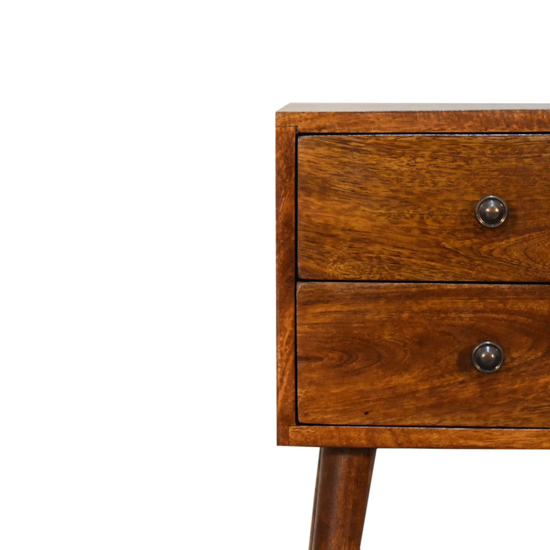 Chestnut two-drawer nightstand close-up of drawer fronts and round metal knobs