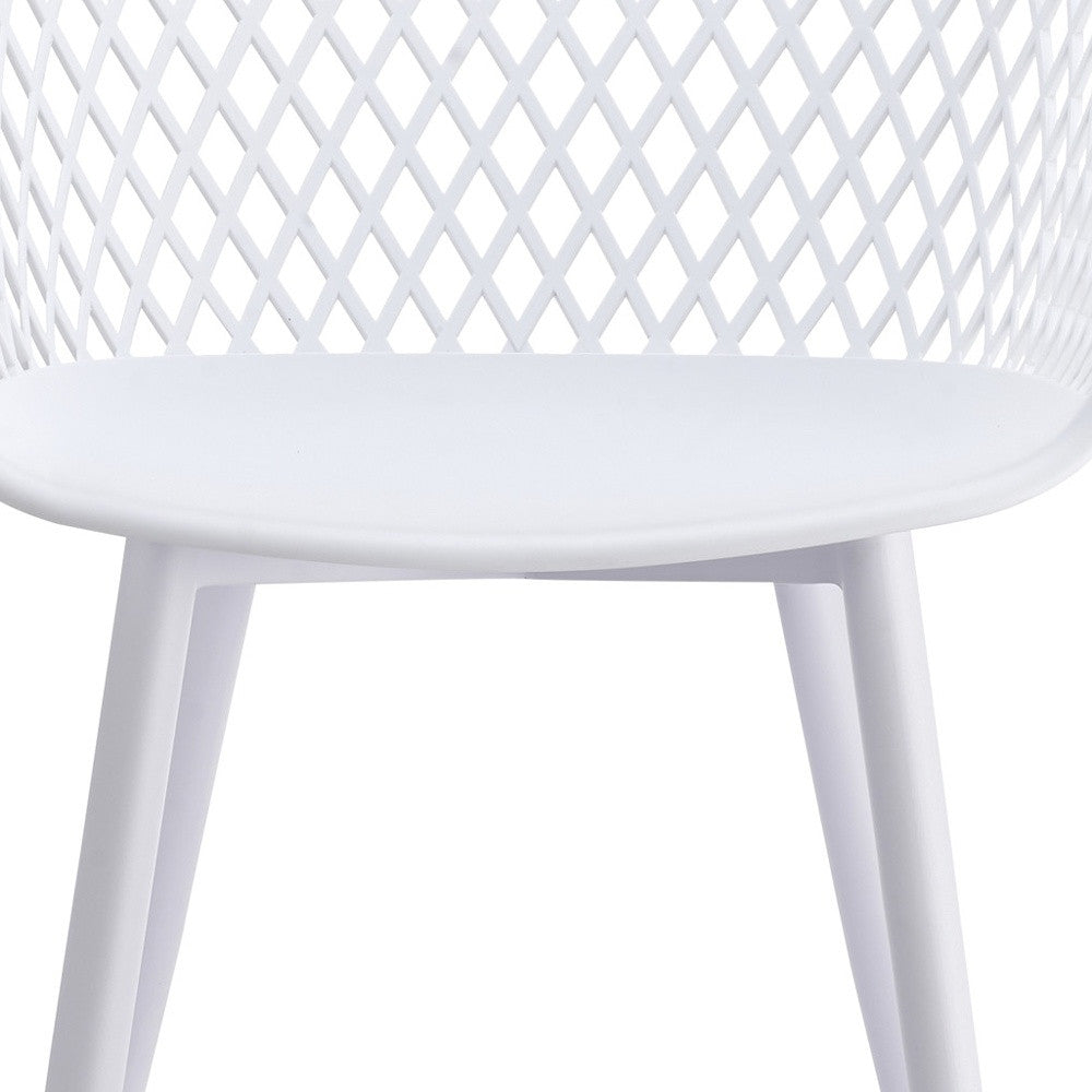 White plastic outdoor stacking dining chair, curved seat and four tapered legs