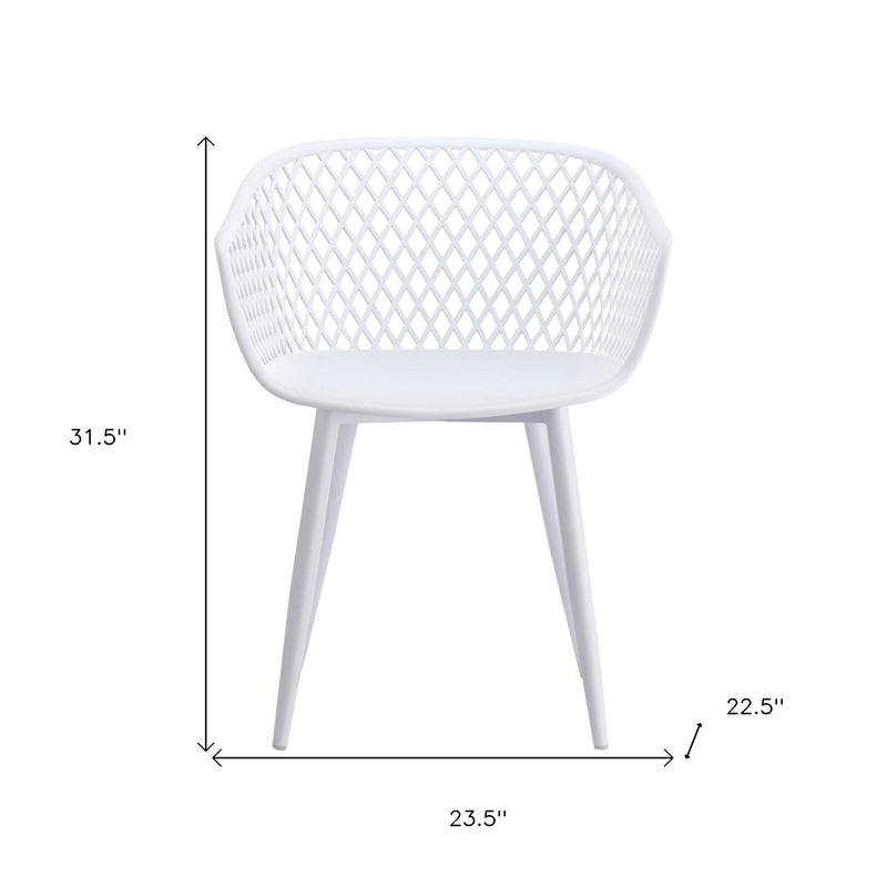 White plastic stacking dining chair with diamond lattice back and curved seat