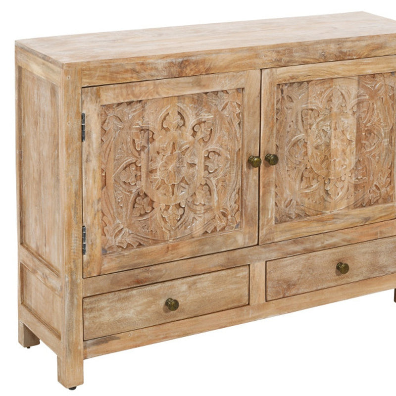 Distressed solid wood sideboard with carved floral doors and matching brass hardware