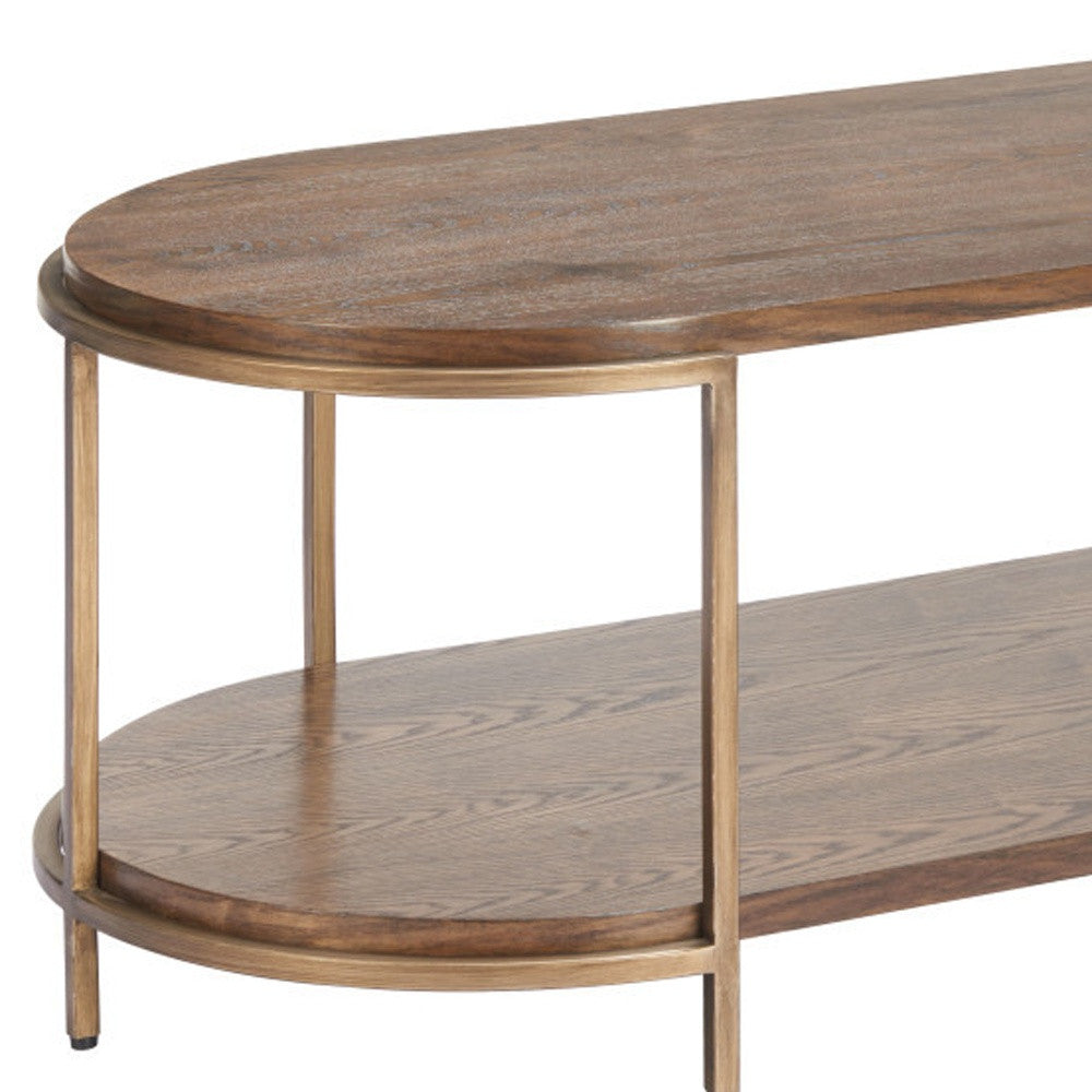 Side view of oval coffee table with warm brown wood top, lower shelf, and steel legs.