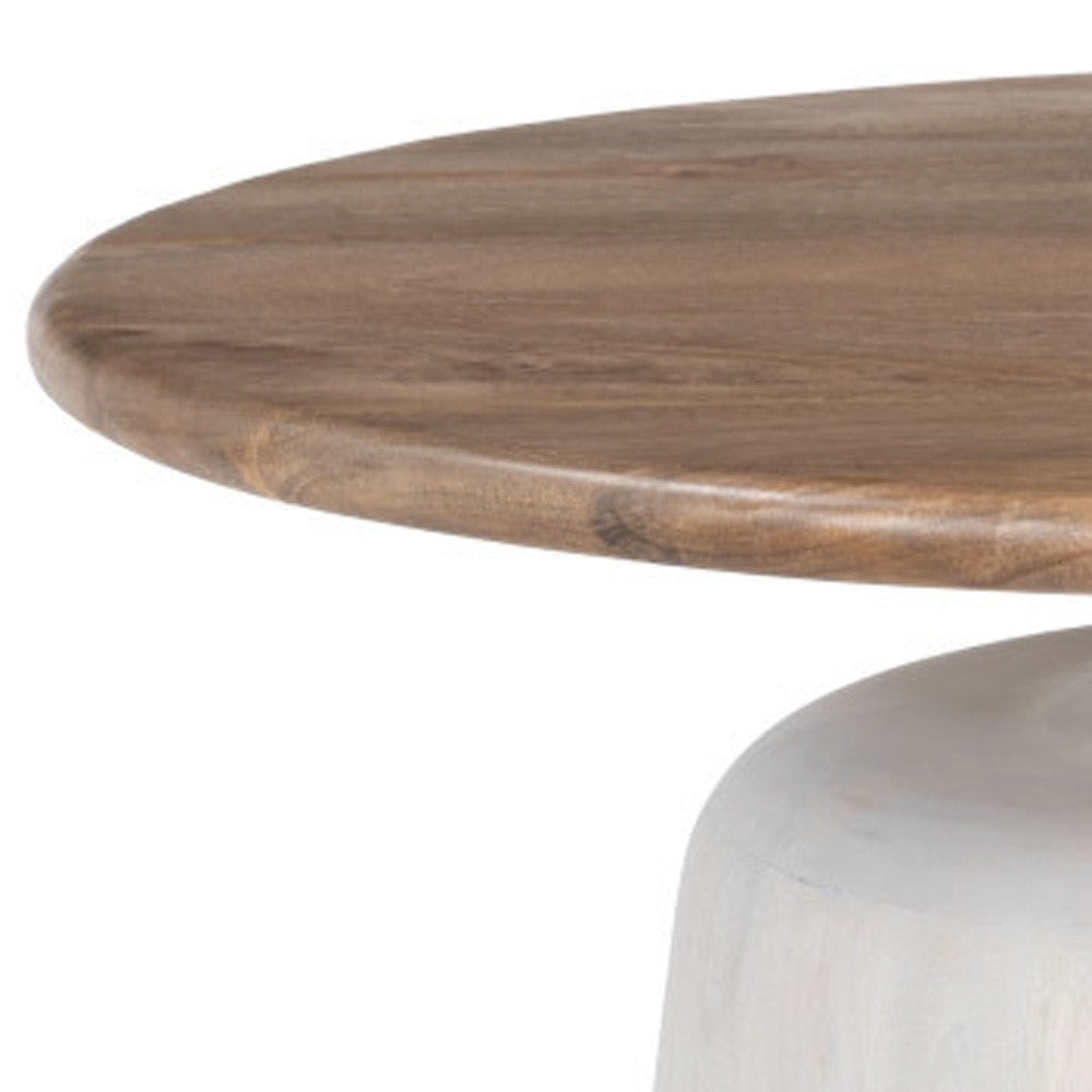 Angle view of brown round tabletop edge and white pedestal base