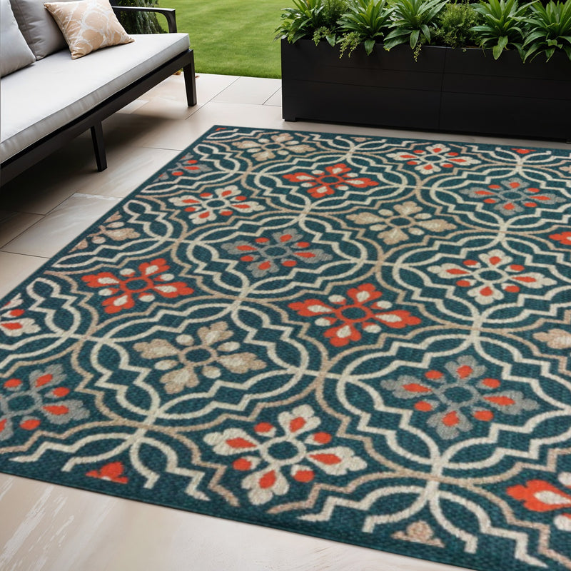 Large view of teal-blue Moroccan area rug with orange-red floral medallions