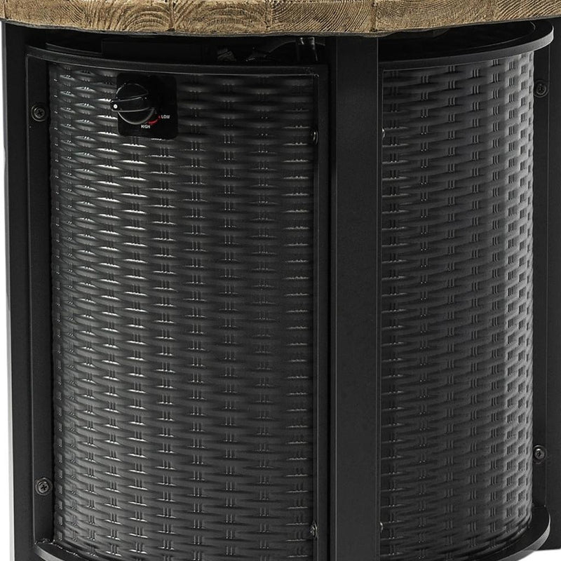 Black round propane fire pit with woven gray cylinder and wood-look tabletop