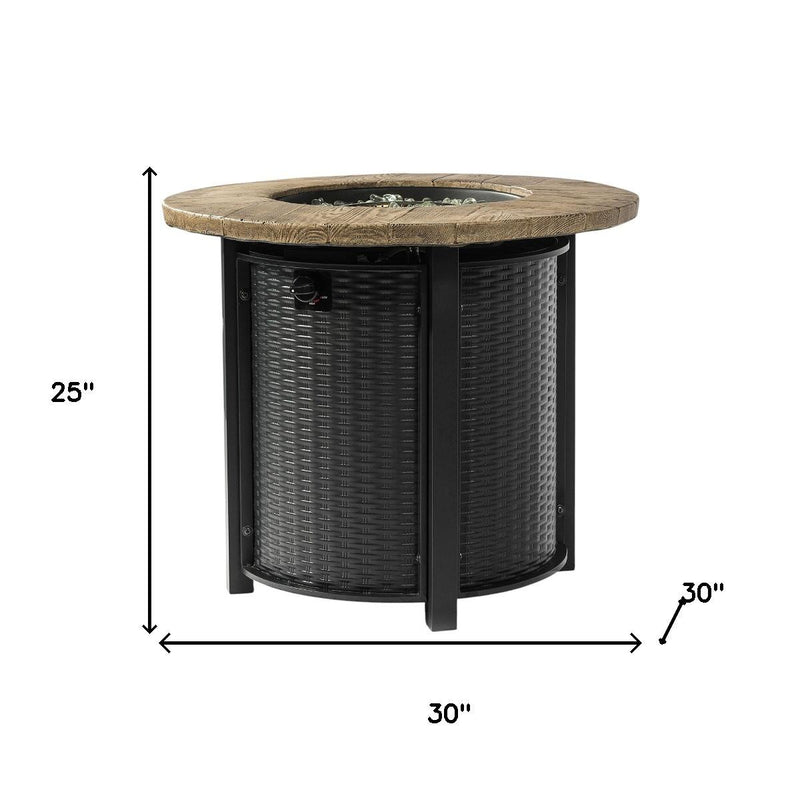 Black round propane fire pit with woven gray sides and wood-look top; size shown