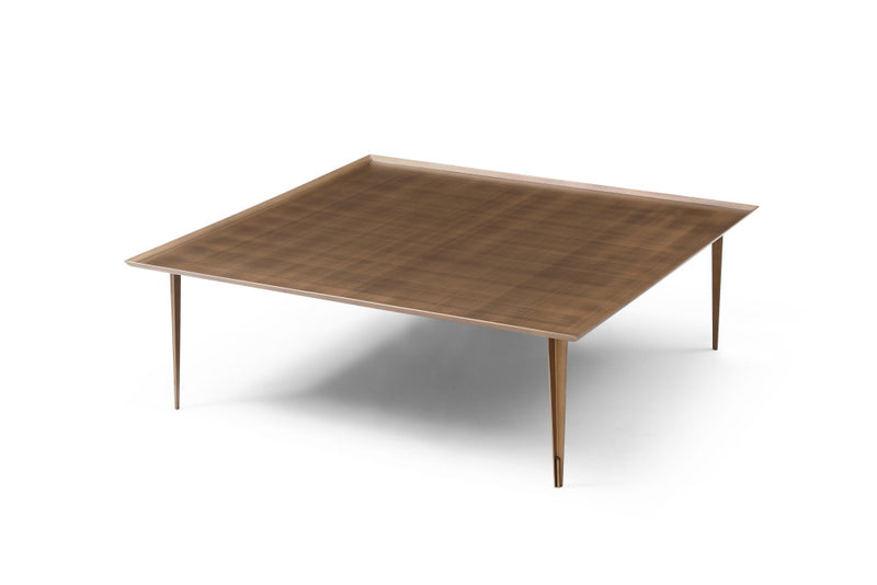 Bronze square coffee table with flat distressed top and four straight legs.
