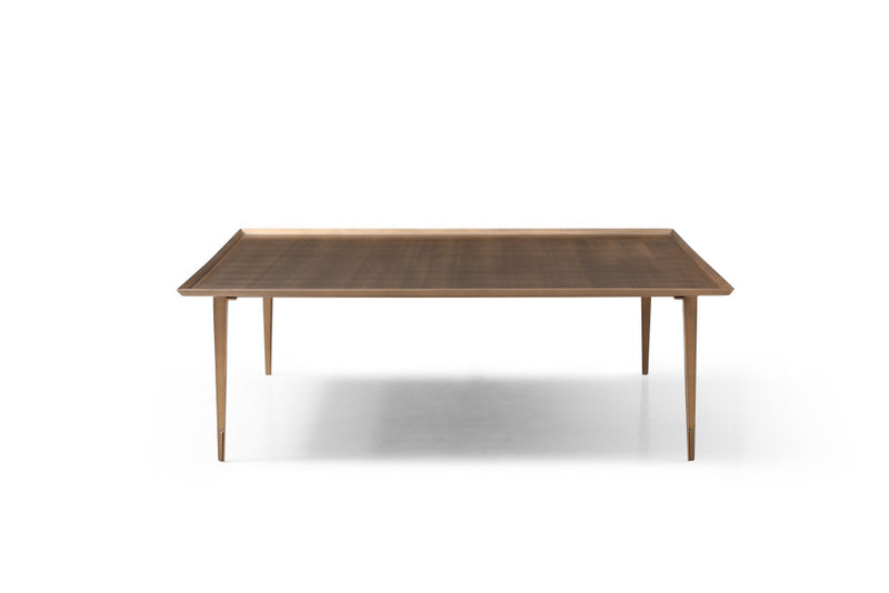 Bronze square coffee table with distressed top and slim legs.