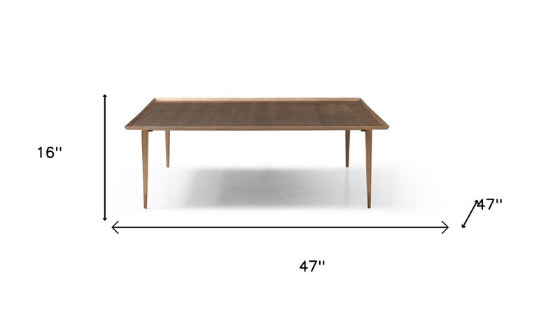 Bronze square coffee table, 47 in wide and 16 in high, distressed top.