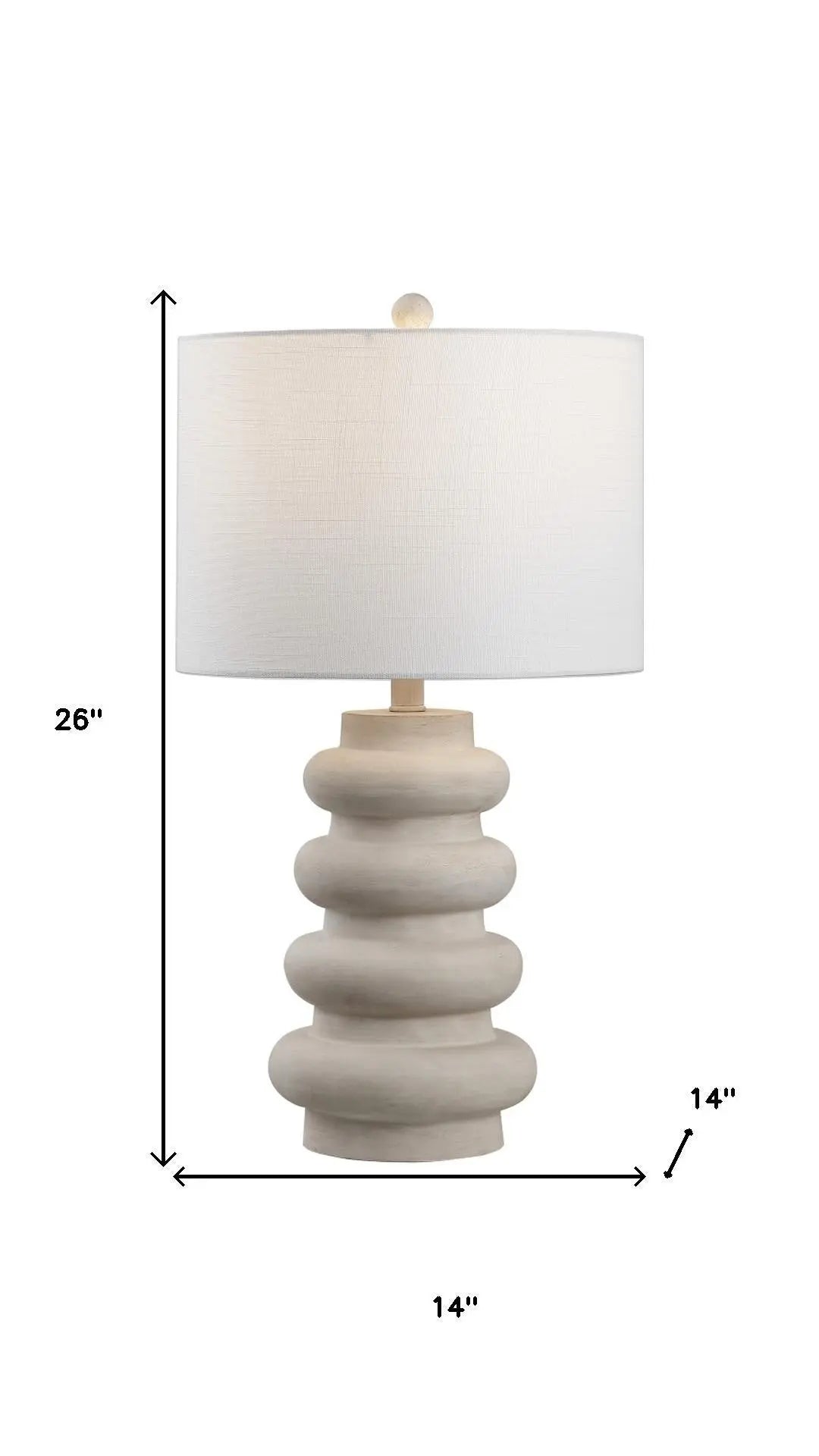 Contemporary beige ceramic lamp with textured base and white fabric shade, 26" tall, perfect for modern decor.