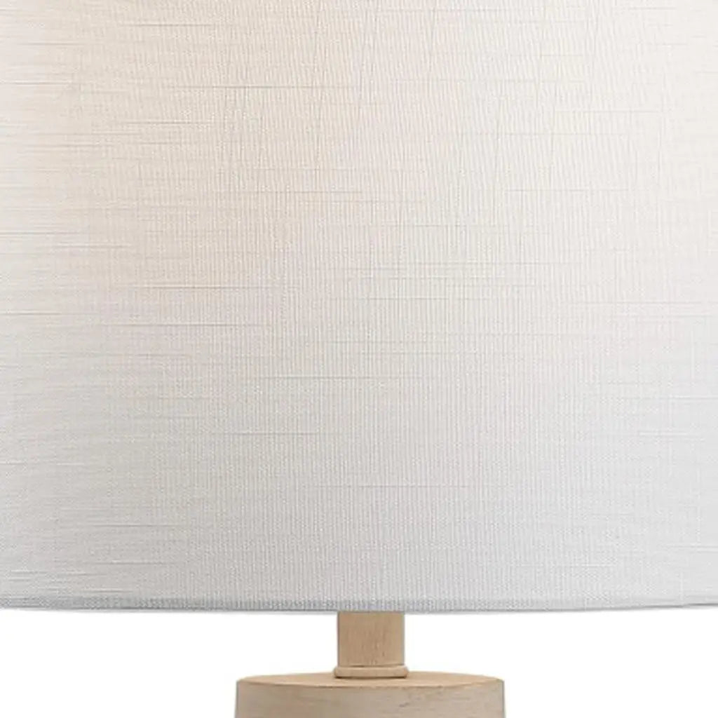White textured lamp shade with natural wood base, perfect for modern and minimalist home décor.