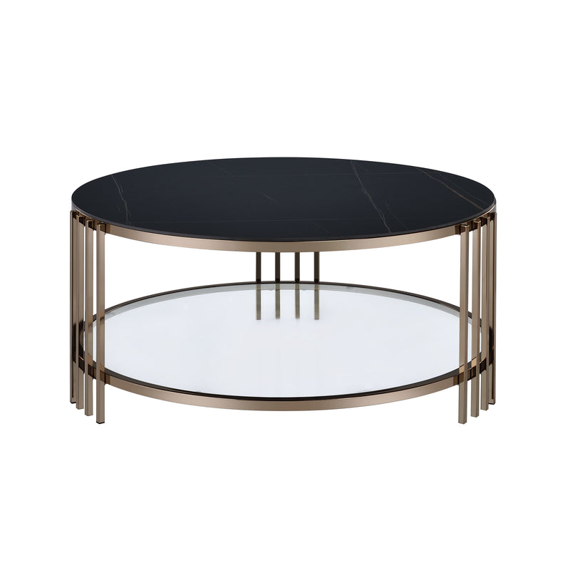 Round coffee table with black top and champagne leg frame over an open lower ring.