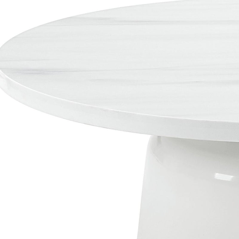 White round pedestal coffee table close-up of glossy faux marble top edge