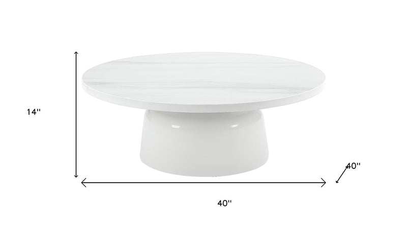 White round pedestal coffee table, 40 in wide and 14 in high
