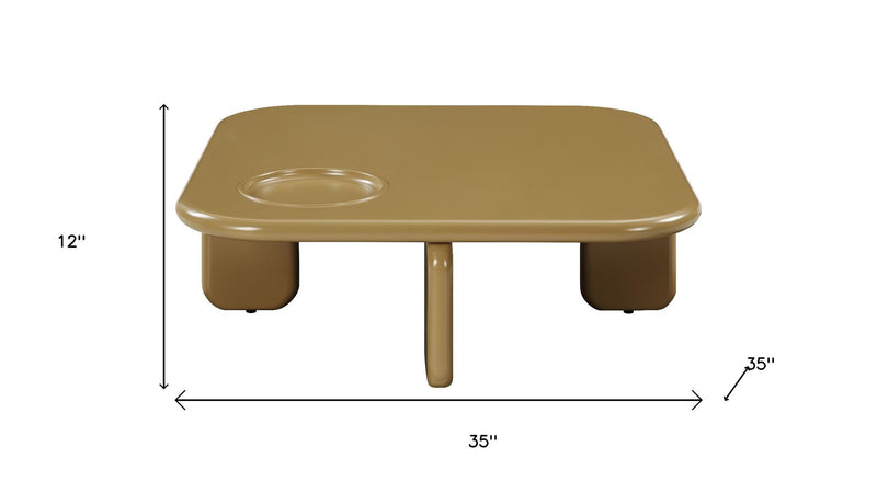 Square golden brown wood coffee table with rounded edges and built-in cup holder
