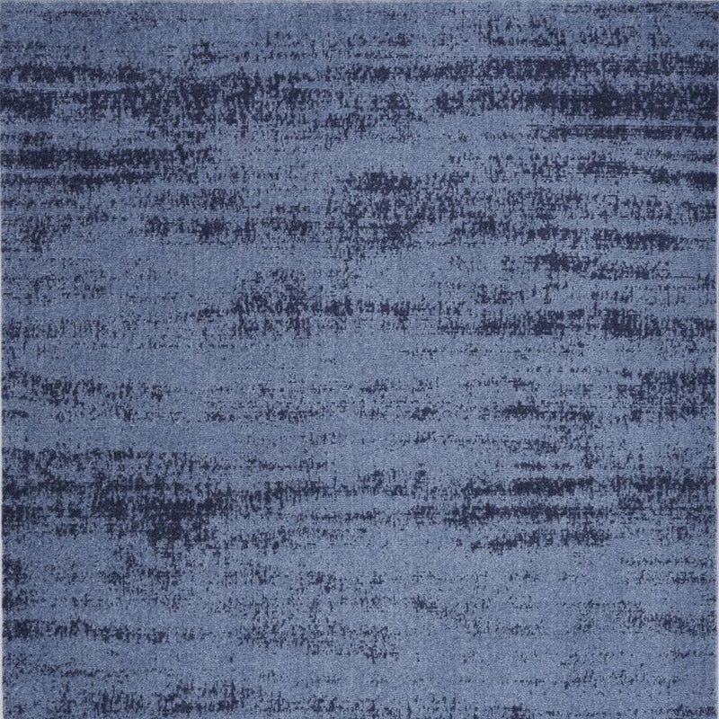 Navy and denim blue abstract area rug with distressed, mottled stripe pattern