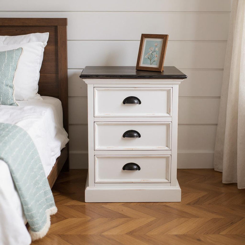 White 3-drawer nightstand with dark top and black curved drawer pulls