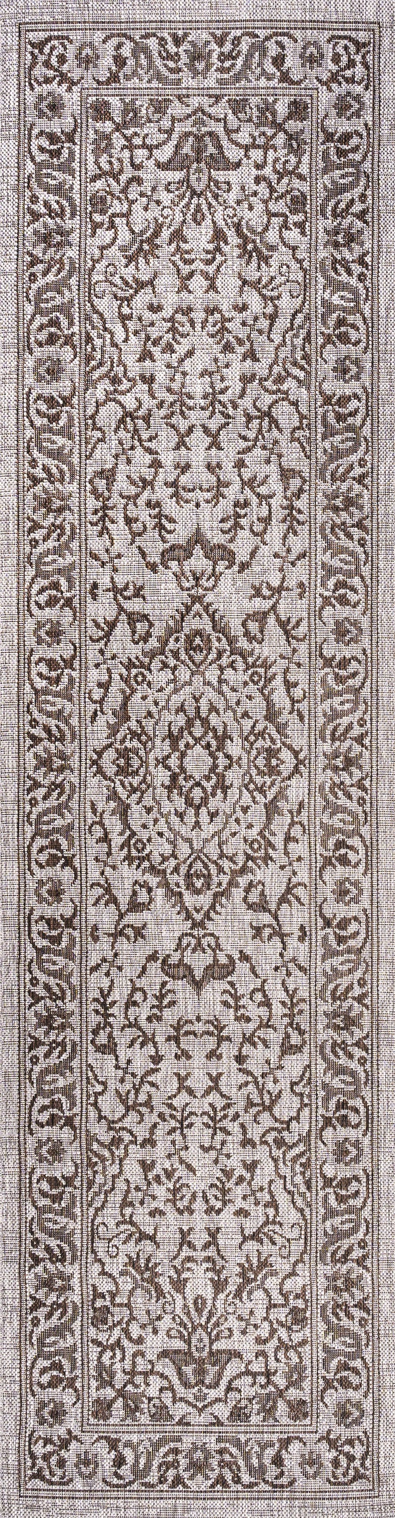 Vertical view of brown and beige medallion runner rug with decorative border.
