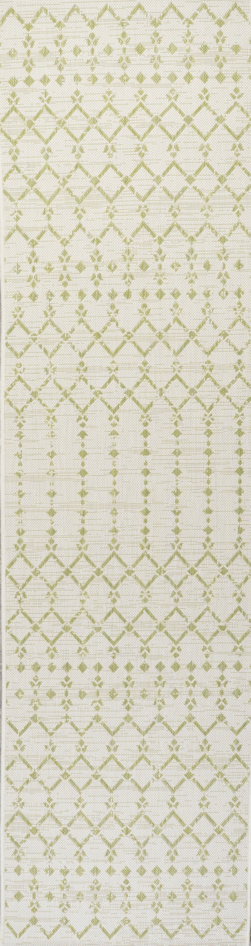 Cream and green trellis runner rug close-up, repeating diamond lattice motif
