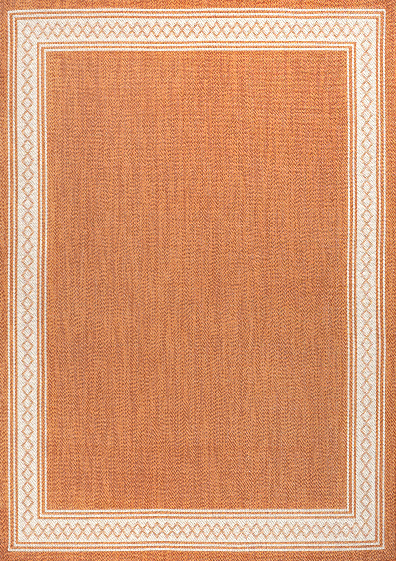 Orange textured area rug with cream outlined border and repeating geometric edge pattern
