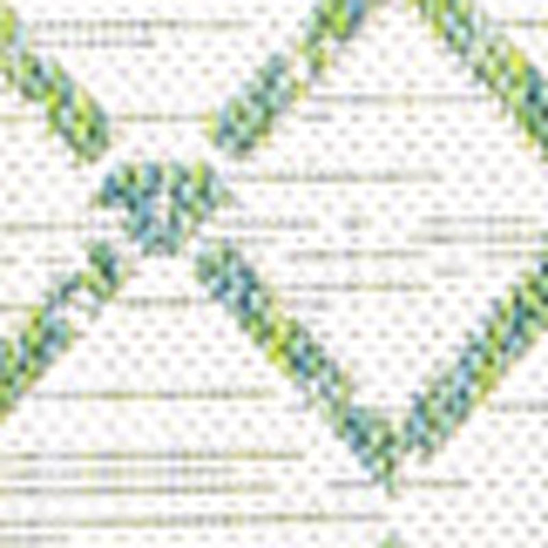 Ivory area rug close-up with green trellis lattice and diamond pattern