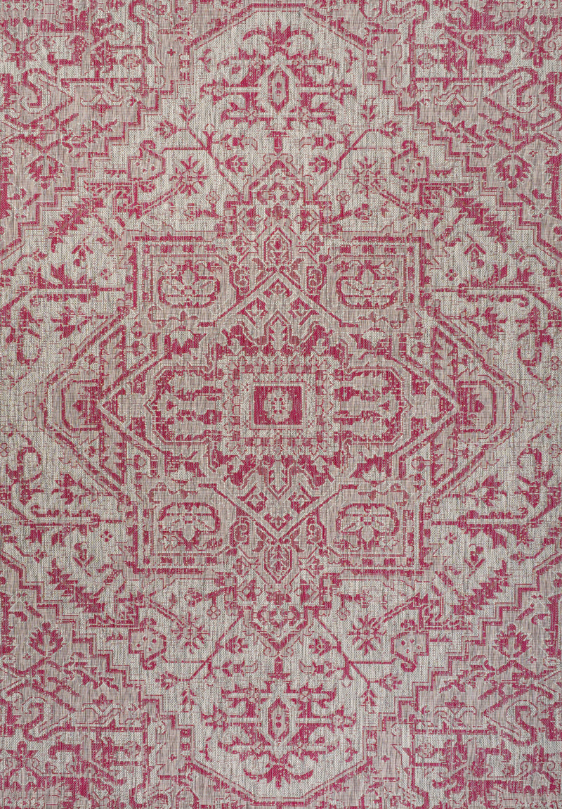 Light gray area rug with central fuchsia medallion and intricate repeating scrollwork