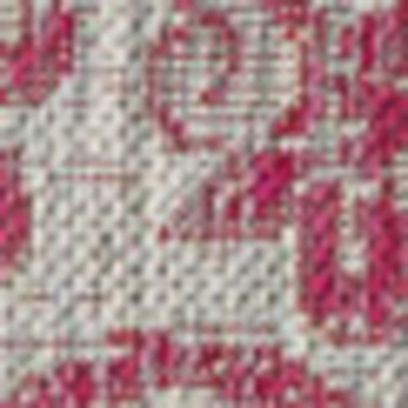 Light gray rug with fuchsia accent details and small medallion motif pattern