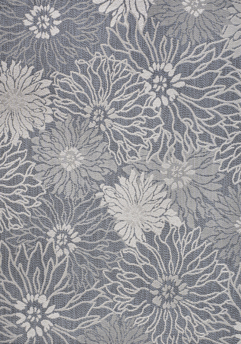 Indoor outdoor area rug close-up of gray and navy floral motif
