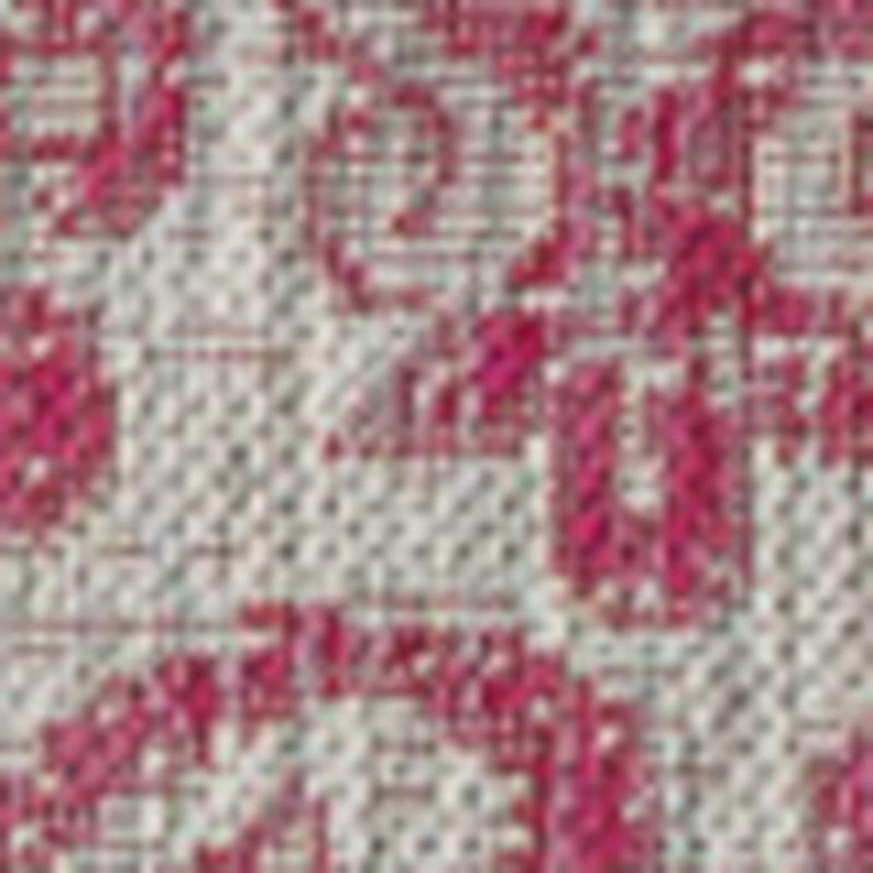 Light gray area rug with fuchsia medallion border and distressed motif pattern