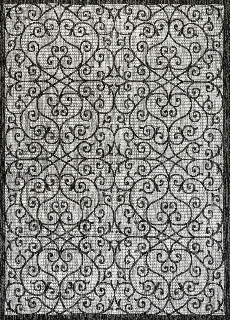 Light gray geometric area rug with dense black scrollwork and textured edge