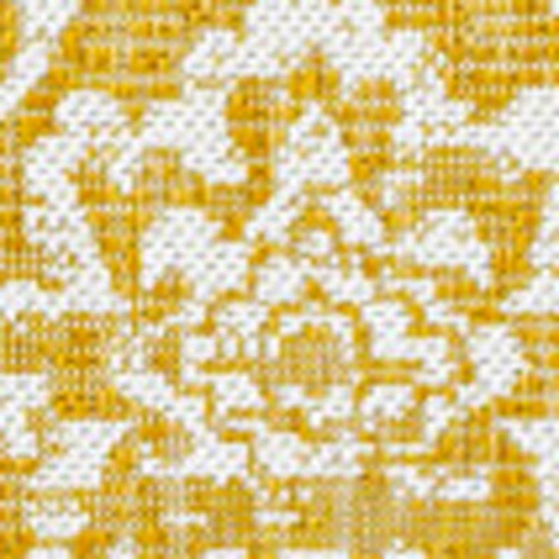 Close-up of yellow and cream medallion rug pattern with detailed grid and motifs