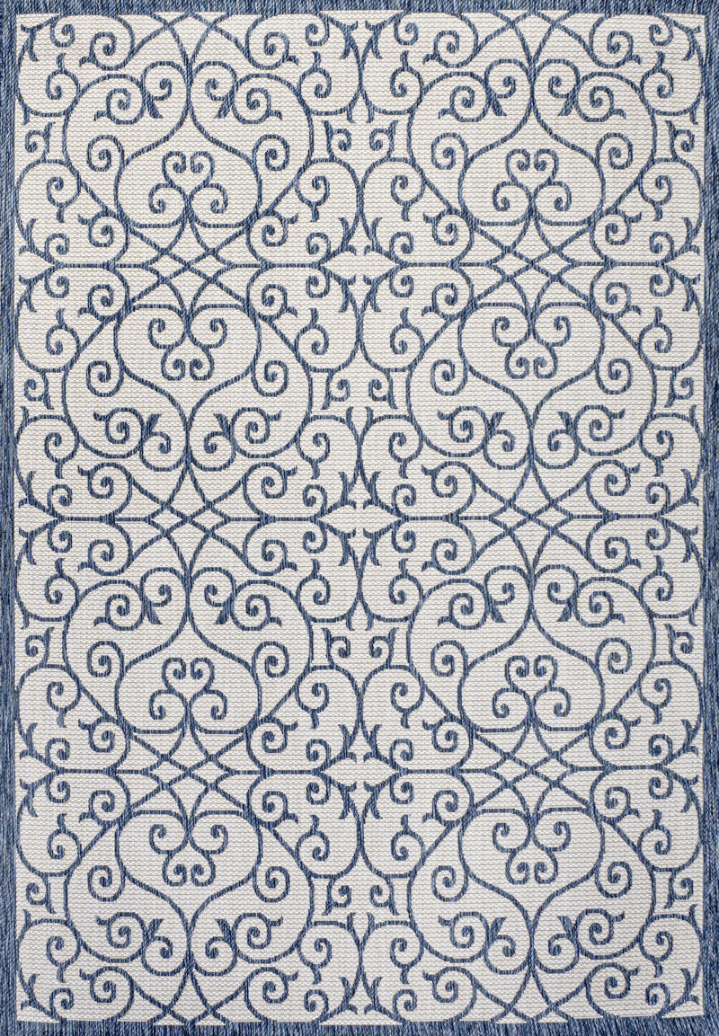 Blue and cream geometric area rug face, ornate damask swirl motif